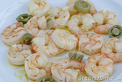 Meal Cooked prawns with pepper on plate in softfocus Stock Photo