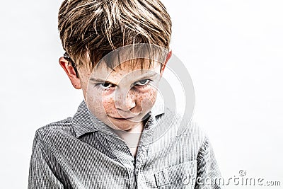 Mean bully boy expressing scary revenge or dark retaliation, isolated Stock Photo