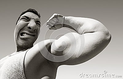 Mean man with big muscles Stock Photo