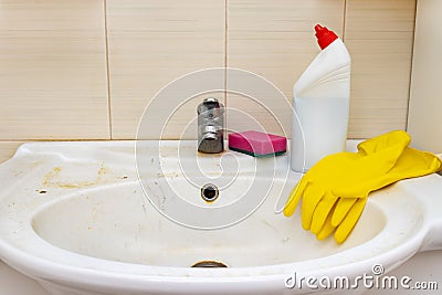 Means , tools for cleaning and desinfecting dirty rusty washbowl, basin with limrscale and soap stains Stock Photo