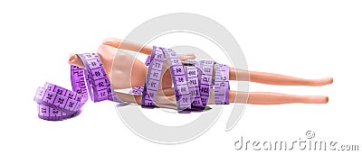 Measure tape with doll Stock Photo