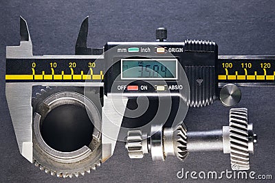 Measurement parameters of gears, details by digital micrometer Stock Photo