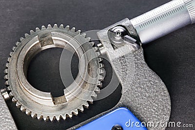 Measurement parameters of gears, details by digital micrometer Stock Photo