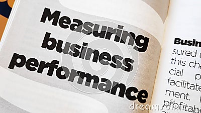 Measuring business performance word printed on a book Stock Photo