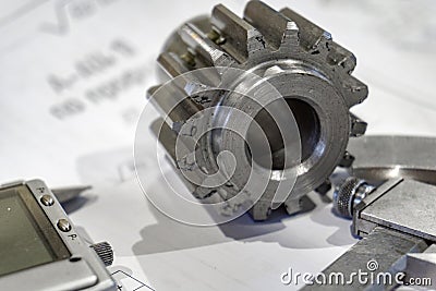 Measuring gears with a caliper in production, high-precision machining Stock Photo