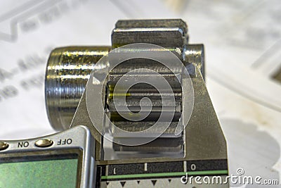 Measuring gears with a caliper in production, high-precision machining Stock Photo