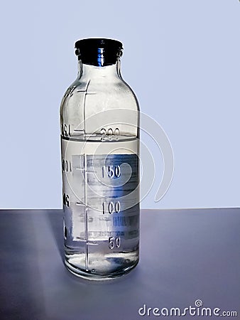 Measuring glass bottle with divisions for medicine Stock Photo