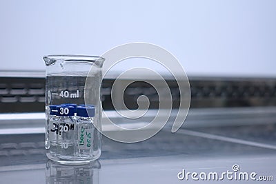 Measuring glass with tubes Stock Photo