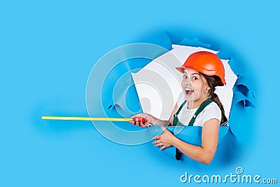 Measuring the height. architect. playing with tools. growing concept. little girl with measuring tape. instruments for Stock Photo