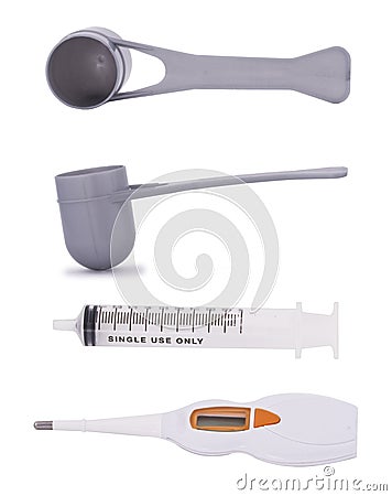 Measuring scoops, syringe and Electronic and digital thermometer Stock Photo