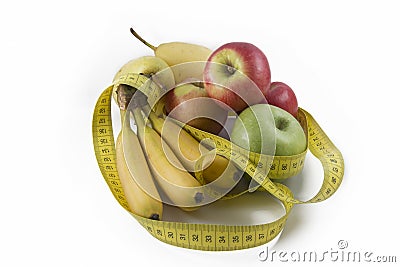 Measuring Tape Wrapped Around Several Fresh Fruits Stock Photo