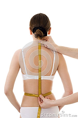 Measuring woman's back Stock Photo