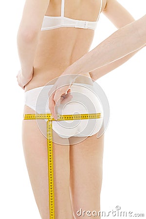 Measuring woman's buttocks size Stock Photo