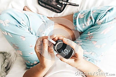 Measurnig blood sugar level Stock Photo