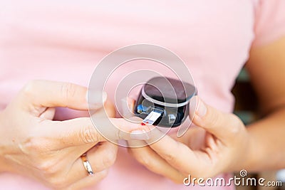 Measurnig blood sugar level Stock Photo