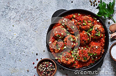 Meat balls in tomato sauce with spices concrete background. Stock Photo