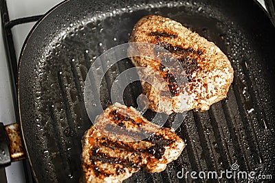 Meat with beautiful roast in pan is fried at home Stock Photo
