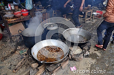 Meat boiling in a caldron in Bac Ha market, Vietnam Editorial Stock Photo