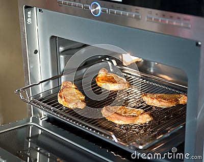 Meat is cooked in the oven Stock Photo