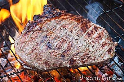 Meat cooking on charcoal grill Stock Photo