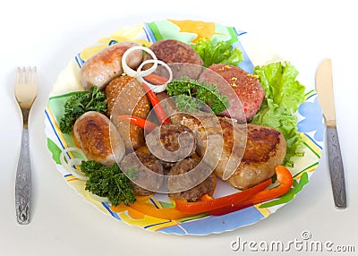 Meat cutlets and small sausages Stock Photo