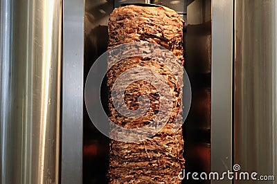 A stick of Arab shwarma in front of the grill Stock Photo