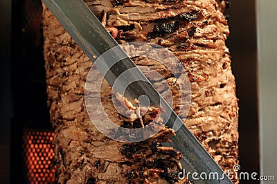 A stick of Arab shwarma in front of the grill Stock Photo