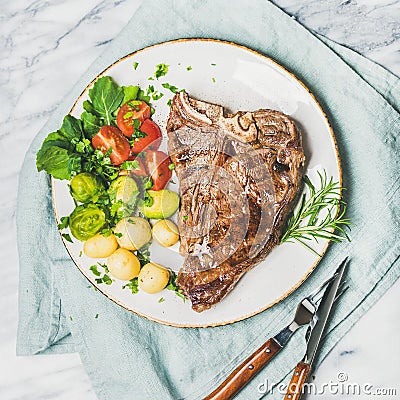 Meat dinner plate with cooked beef tbone steak, square crop Stock Photo