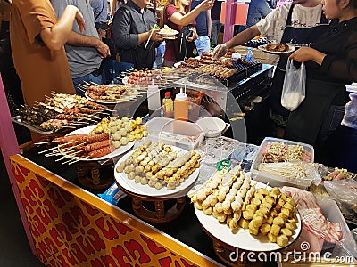 Meat dishes of different types on skewers in Thailand on the market. Editorial Stock Photo