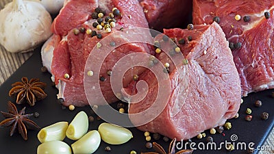 Meat dishes are prepared in the restaurant by the chef. Organic meat from the farm. Pork from the farm sprinkled with spices and Stock Photo