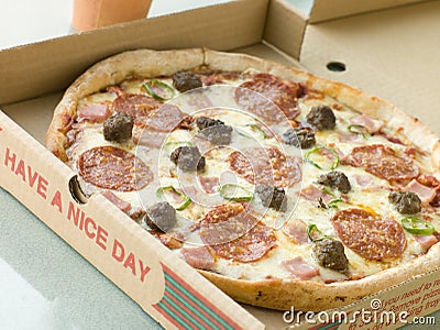 Meat Feast Pizza in a Take Away Box Stock Photo