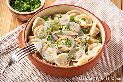 Meat filled dumplings, pelmeni, Russian cuisine. Stock Photo