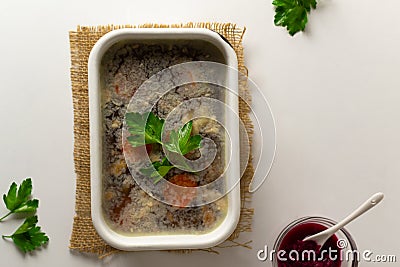 Meat jellied meat with parsley in a traditional dish. Festive dishes. Stock Photo