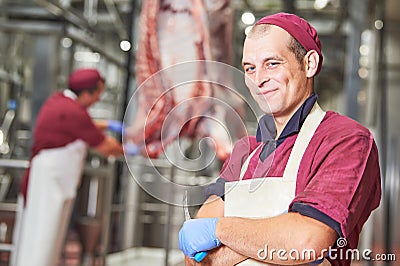 Meat manufacturing factory. Portrait of young butcher Stock Photo