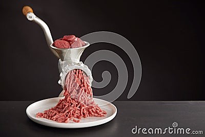 Meat mincing with old grinder Stock Photo