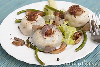 Meat pelmeni with fungi Stock Photo