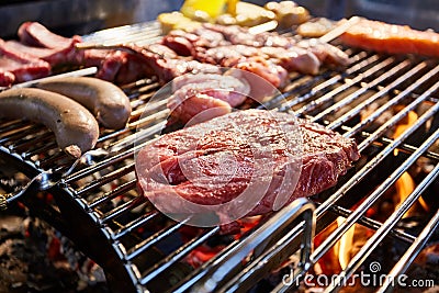 The meat is pickled on a lattice grill, ribs spread, a stake, Sausages, edges, chicken, naked flame, black pepper, a Stock Photo