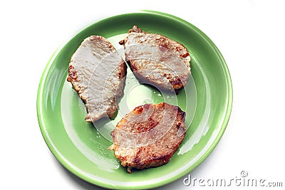 Meat on a plate on a white background. Stock Photo