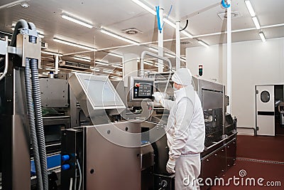 Automated production line with packaging and cutting of meat in modern food factory.Meat processing equipment. Stock Photo