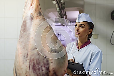 Meat quality control in butchery. Stock Photo