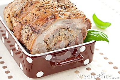 Meat roll with basil leaves Stock Photo