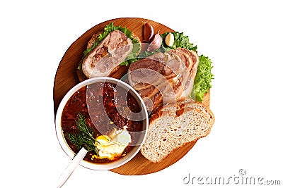 Meat roll sliced into pieces and a plate of borsch Stock Photo