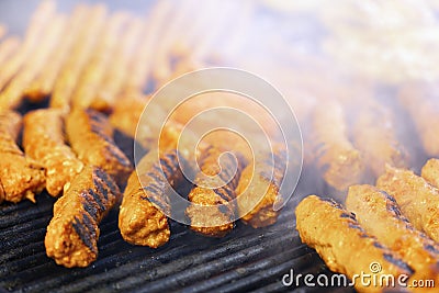 Meat rolls mititei, mici on the grill which is a traditional Balcanic Stock Photo