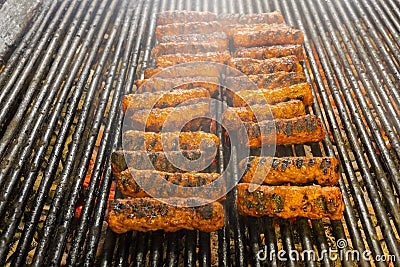 Meat rolls mititei, mici on the grill which is a traditional Balcanic Stock Photo