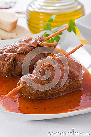 Meat roulade on white dish. Stock Photo