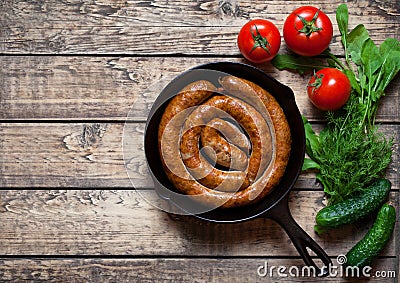 Meat sausage homemade roasted barbecue meal with tomatoes and herbs Stock Photo