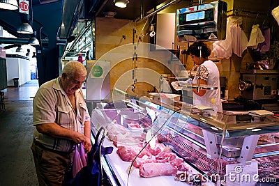 Meat seller La Boqueria Market in Barcelona, Spain Editorial Stock Photo