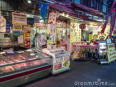 Meat shop and street food in Tokyo Editorial Stock Photo