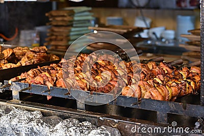 Meat skewers on bbq, open kitchen Stock Photo