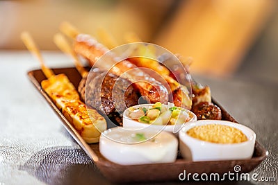 Meat on skewers grilled on fire. Stock Photo